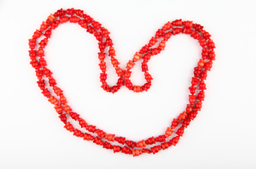 red female beads white background studio 