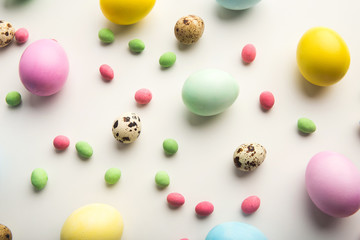 Easter background. Colored eggs on white, isolated
