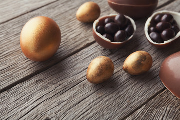 Chocolate easter eggs on wooden background