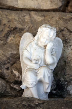 A white mourning porcelain angel at Mirogoj cemetery, Zagreb, Croatia