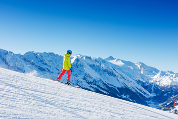 Girl snowboarder having fun in the winter ski resort.