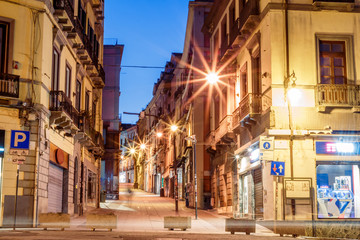morning streets with lanterns and cafes in Cagliari Italy