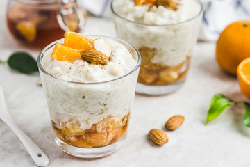 Healthy vanilla  oatmeal porridge with fresh fruit and nuts. Selective focus, space for text.
