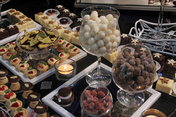 Colorful desserts and pastry served on a wedding party