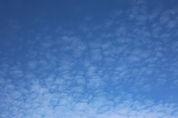 Fototapeta na wymiar Blue sky background with clouds and copy space.