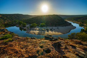 sun over horseshoe bend, kalbarri national park, western australia 7
