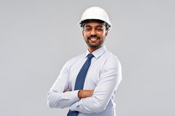 architecture, construction business and building - smiling indian architect or businessman in...