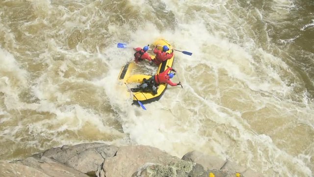 White water rafting, stuck in a wave
