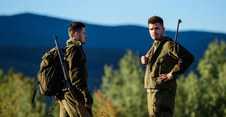 Man hunters with rifle gun. Boot camp. Friendship of men hunters. Army forces. Camouflage. Military...