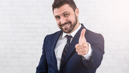 I choose you. Businessman pointing finger to camera