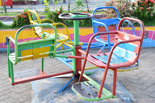 colorful chairs in amusement park