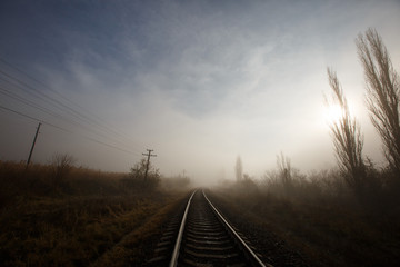 Fototapeta na wymiar railway in the fog