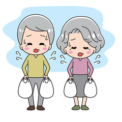 Old people with heavy shopping bags