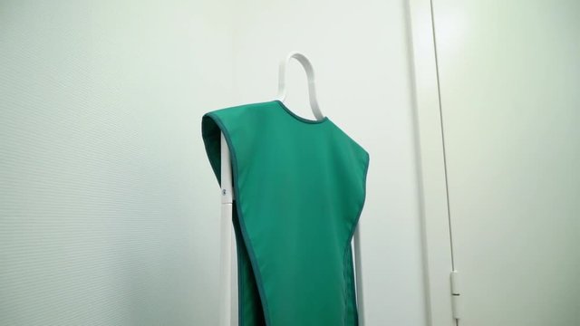 X-ray protection clothes. Green vest in radiology clinic.