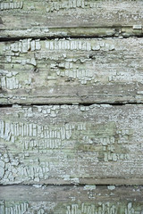 Green peeling wall. White and green wooden background.
