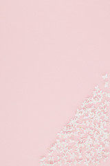 Pink background with white lilac flowers