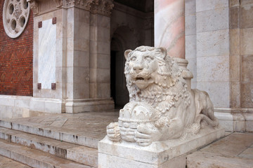 lion statue Cathedral of Our Lady of Hungary entrance Szeged