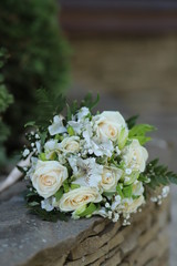 wedding bouquet with roses on the grass