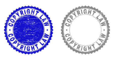 Grunge COPYRIGHT LAW stamp seals isolated on a white background. Rosette seals with grunge texture in blue and gray colors. Vector rubber stamp imitation of COPYRIGHT LAW label inside round rosette.