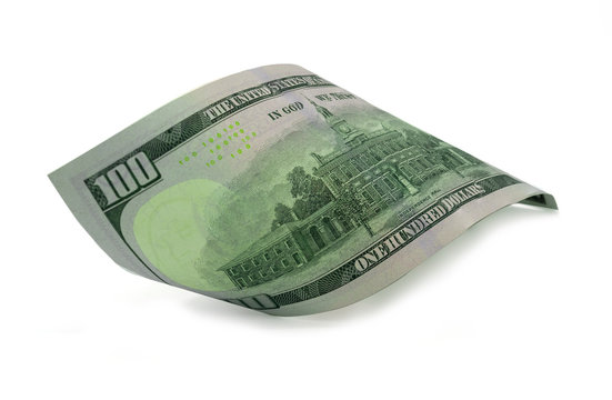 Close-up isolated rolled American US dollar banknotes on white background. Clipping path- Image