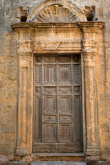 Fototapeta na wymiar gate of an ancient church in tuscany.