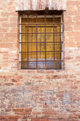 old yellow window with rusty railing.