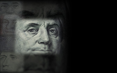 Benjamin Franklin face from US dollar black background - Image