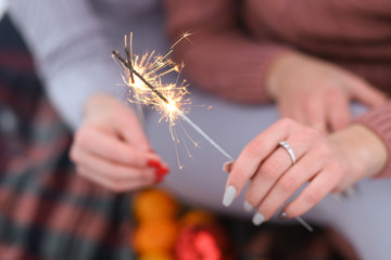 sparklers in the hands of girlfriends