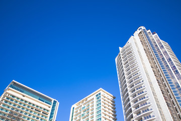 Fototapeta na wymiar Three hotels buildings on a sunny day with a blue sky