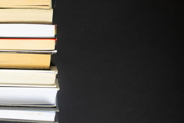 Stack of books on black background