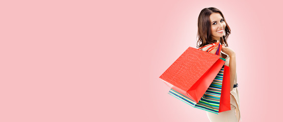 Young happy woman with shopping bags