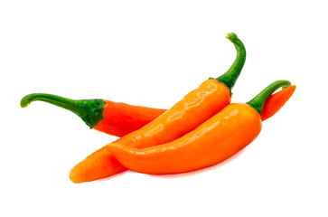 Closeup side view of three yellow chili pepper  on white background, raw food ingredient concept. Clipping path - Image.