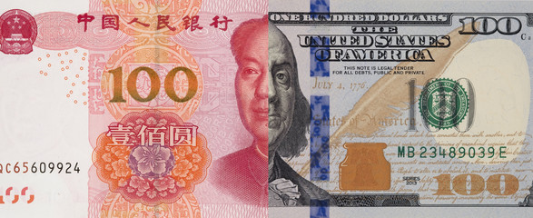 Half face to face of US dollar banknote and China Yuan banknote for 2 biggest economic in the world which now United states and China have trade war.Both countries conflict increase tariff tax. 