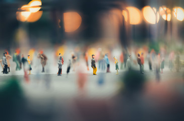 miniature people walking on streets,people are moving across the pedestrian crosswalk in the city road