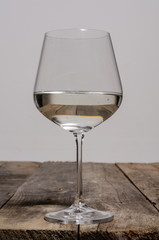Top view of blank white dish and white tablecloth on a wood background with copy space
