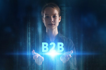 The concept of business, technology, the Internet and the network. A young entrepreneur working on a virtual screen of the future and sees the inscription: B2B