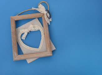 Disassembled frame with a heart lies on a blue background