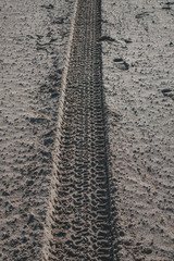 Leading sand tracks tyre trail on a beach in the Netherlands, Brouwersdam with beautiful texture