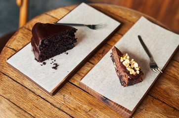 Delicious slices of chocolate cake sitting on a cafe table