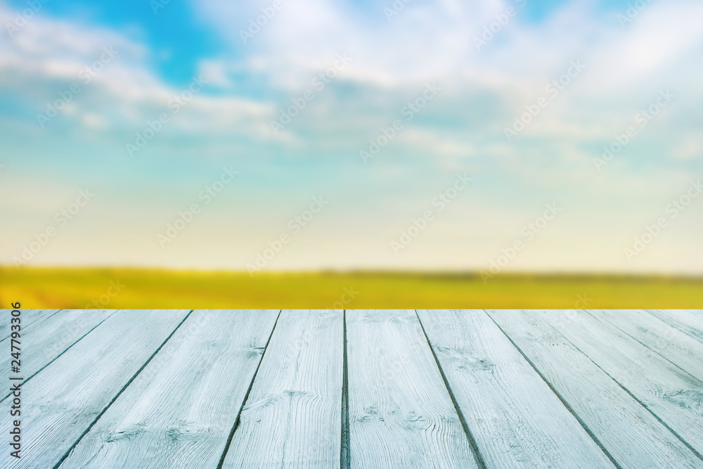 Wall mural blue table on blurred background of landscape with blue sky - can use for display or montage your pr