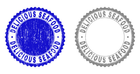Grunge DELICIOUS SEAFOOD watermarks isolated on a white background. Rosette seals with grunge texture in blue and gray colors.