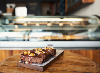 Naklejka na ściany i meble Slices of yummy chocolate cake sitting on a bakery table