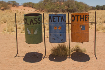 colorful trashcans on african campsite
