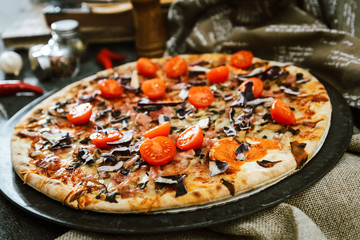 pizza cooked with standard cooked ham and mushrooms