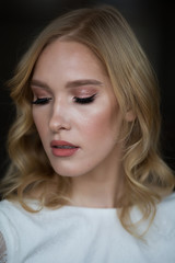Fototapeta premium Portrait of a beautiful bride with bright makeup