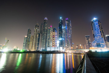 Fototapeta na wymiar Dubai, United Arab Emirates - October, 2018: View of Dubai city downtown by night