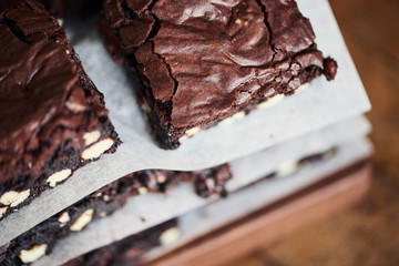 Closeup of a freshly baked stack of nutty chocolate brownies 