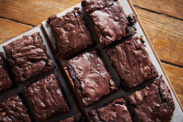 Stacks of homemade chocolate brownies sitting on a cafe table