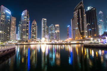 Fototapeta na wymiar Dubai, UAE - April 2013: The skyscrappers around the marina at night