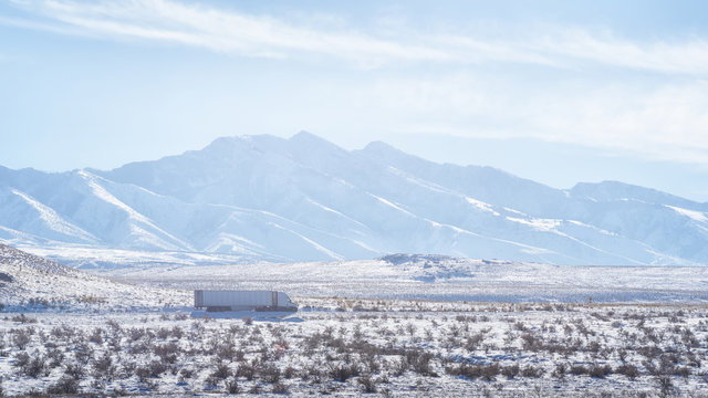 Semi Truck On Snowy Desert Highway